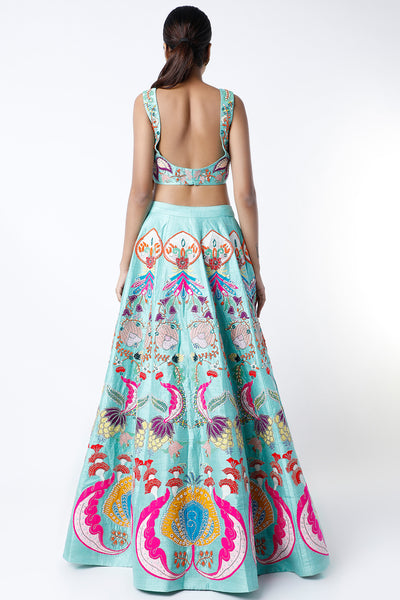 Back view of scuba blue nadenka raw silk appliquéd lehenga with blouse and cutwork dupatta