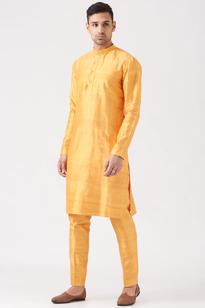 Left side view of yellow pastiche raw silk printed and embellished bundi with yellow raw silk kurta and pant